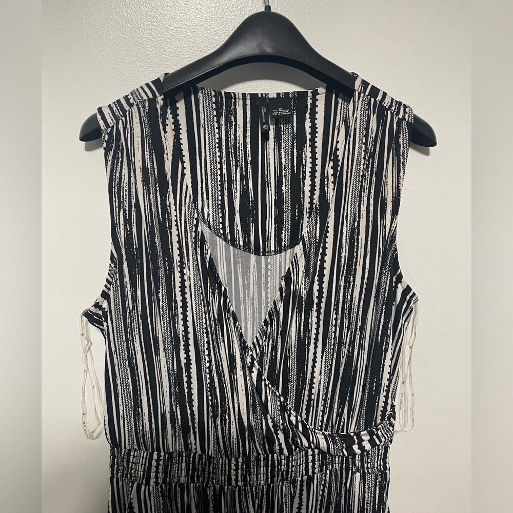 New! Never been worn! Size 1z Jumpsuit.